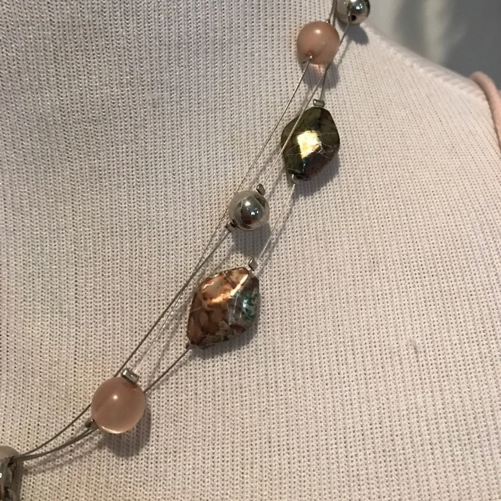 Faceted colorful pendant on triple wire with beads